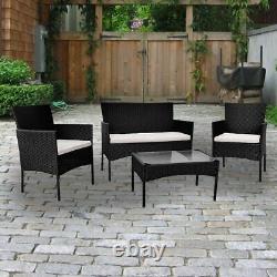 Ensemble de meubles de jardin en rotin comprenant 4 pièces : chaises, table et canapé pour patio extérieur.